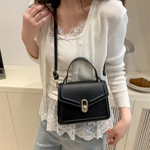 Classic black rectangular leather shoulder bag with gold oval twist lock for women