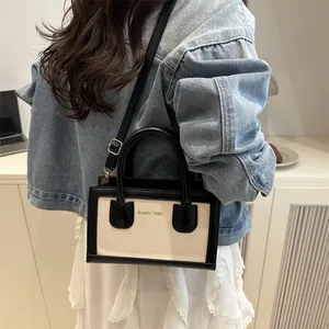 Retro contrast stitching tote bag with black leather and beige canvas for daily commute