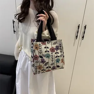 Vintage floral jacquard tote bag with black woven handles for stylish daily commute