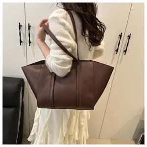 Large capacity dark brown tote bag shown on shoulder for realistic size and fit