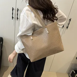 Khaki crocodile pattern tote bag for women showing large capacity and shoulder strap