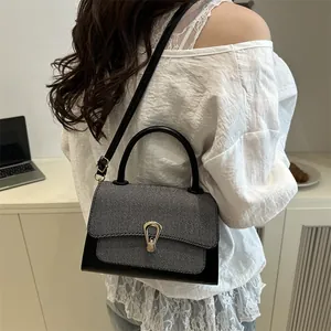 Elegant two-tone crossbody bag for women with gold U-shaped buckle and leather strap