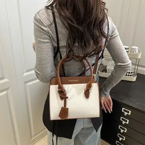 Retro white and brown bicolor tote bag for women with dual handles and crossbody strap