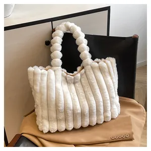 Detailed macro view of the white plush tote bag with unique textured vertical stripes