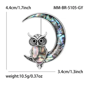 Moon and owl brooch with colorful abalone shell inlays and sparkling crystal accents
