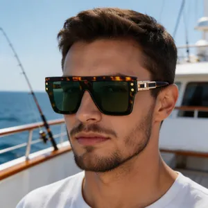 Detail of square polarized sunglasses with tortoiseshell frame and gold metal accents