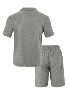 Detail view of grey textured knit shirt and shorts set with elastic waist and back pocket