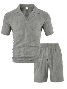 Macro detail of men's grey ribbed knit texture on the short sleeve shirt and shorts set