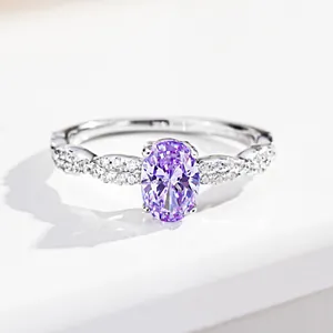 Detailed view of oval purple moissanite ring with twisted pavé band in 925 silver