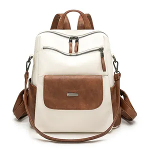 Detail view of large capacity faux leather backpack with stylish contrast colors