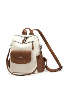 Detailed side view of high-quality color-block leather backpack with zipper pockets