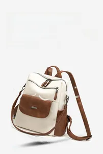 Lightweight two-tone backpack with feathers illustrating a soft, airy design for women