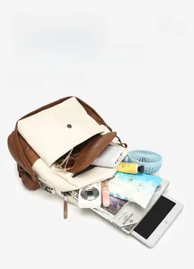 Flat lay of a large capacity contrast-color backpack showing its spacious interior storage