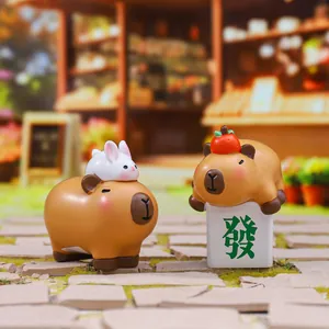 Cute Capybara resin figurines featuring a rabbit and mahjong tile for desk decoration
