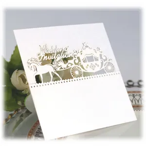 Elegant white laser-cut wedding place card with carriage design and pearlescent finish