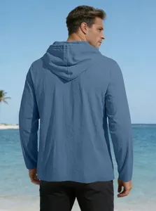 Detail showing the deep blue breathable cotton fabric texture on a hooded casual shirt for men