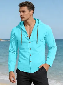 Detail of blue men's hooded cotton shirt with buttons and woven drawstring at beach