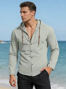 Close-up of light grey hooded cotton shirt with woven drawstrings on a sunny beach