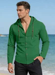 Close-up of forest green hooded cotton shirt featuring brown drawstrings and button detail