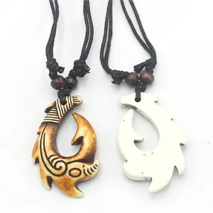 Maori style resin fish hook pendant necklaces in brown carved and plain white design