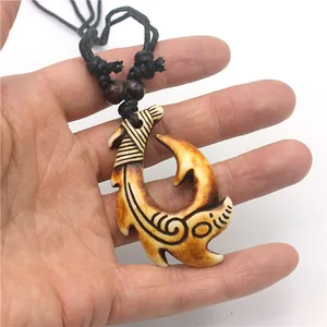 Maori style resin fish hook pendant necklace with antique finish on black woven cord