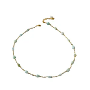 Handmade necklace with pale green stones, white pearls and adjustable gold chain