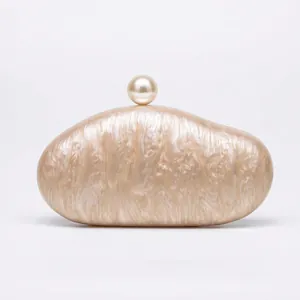 Elegant champagne marble acrylic shell clutch bag with a large pearl top clasp for weddings