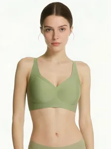 Detailed close-up of bean green seamless V-neck bra with wide shoulder straps and rib texture