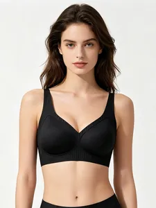 Detail of black seamless V-neck bra with wide shoulder straps and ribbed band support