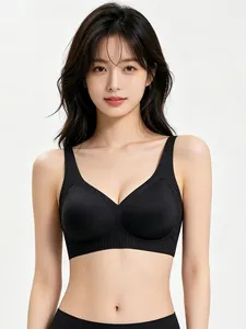 Detail view of seamless black V-neck bra with soft jelly support and wide shoulder straps