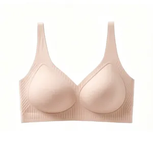 Close-up of seamless deep V-neck bra with jelly strip support and nude fabric texture