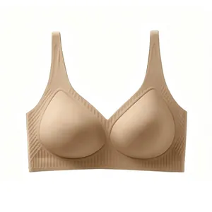 Detail showing seamless V-neck bra with vertical striped ribbing and soft skin-tone fabric