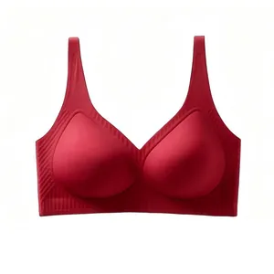 Macro shot of seamless red V-neck bra showing soft jelly strip support and fabric texture