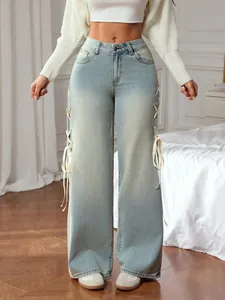 Light blue wide-leg high-waist jeans with side lace-up ribbon design and washed finish