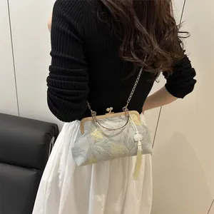 Elegant blue floral shell bag with gold chain strap and tassel for women