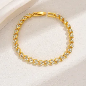 Macro detail of golden heart link bracelet featuring sparkling inlaid zircons