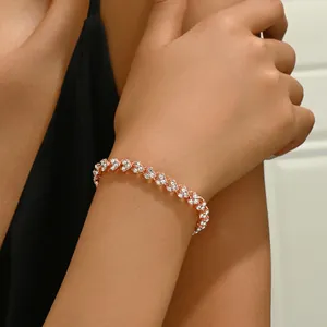 Rose gold bracelet for women with interlocking crystal-encrusted heart-shaped links