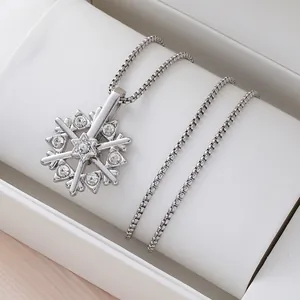 Rotating snowflake pendant necklace with cubic zirconia on a classic silver box chain