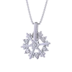 Trendy rotating snowflake pendant necklace with crystals and star detail on silver chain