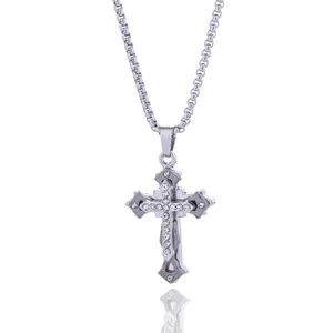 Polished titanium steel cross pendant necklace with white crystals on white background