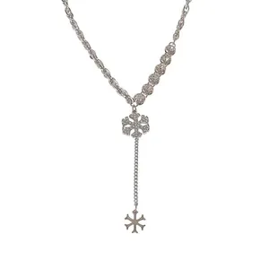 Sparkling silver Y-shaped necklace featuring dual diamond-encrusted snowflake pendants