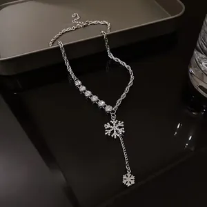 Silver snowflake necklace with zircon stones on an elegant long braided chain link