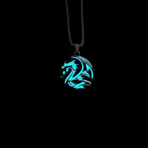 Glow-in-the-dark dragon pendant necklace with cyan luminous pattern on black base