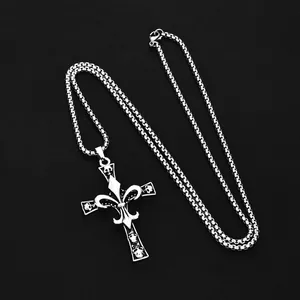 Gothic silver skull cross necklace with fleur-de-lis pattern on a black background