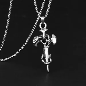 Macro detail of retro punk sword necklace with snake cross pendant and black gemstone