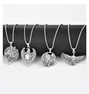 Detail view of four vintage silver stainless steel animal pendants on black displays