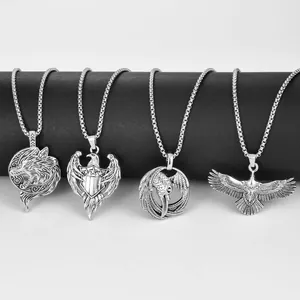 Set of four vintage stainless steel animal pendants featuring eagles and wolves on chains