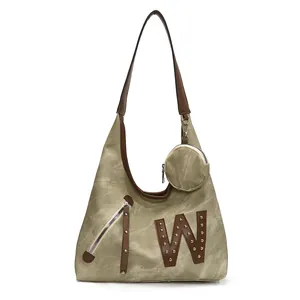 Vintage olive canvas shoulder bag with brown leather W patch and matching mini pouch