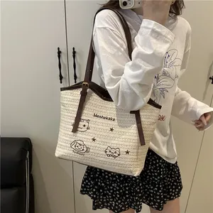Grand sac cabas tressé avec broderie chat et lanières en cuir pour voyage d'été