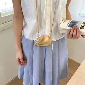 Golden shell-shaped metallic mini box bag with textured surface and fine snake chain